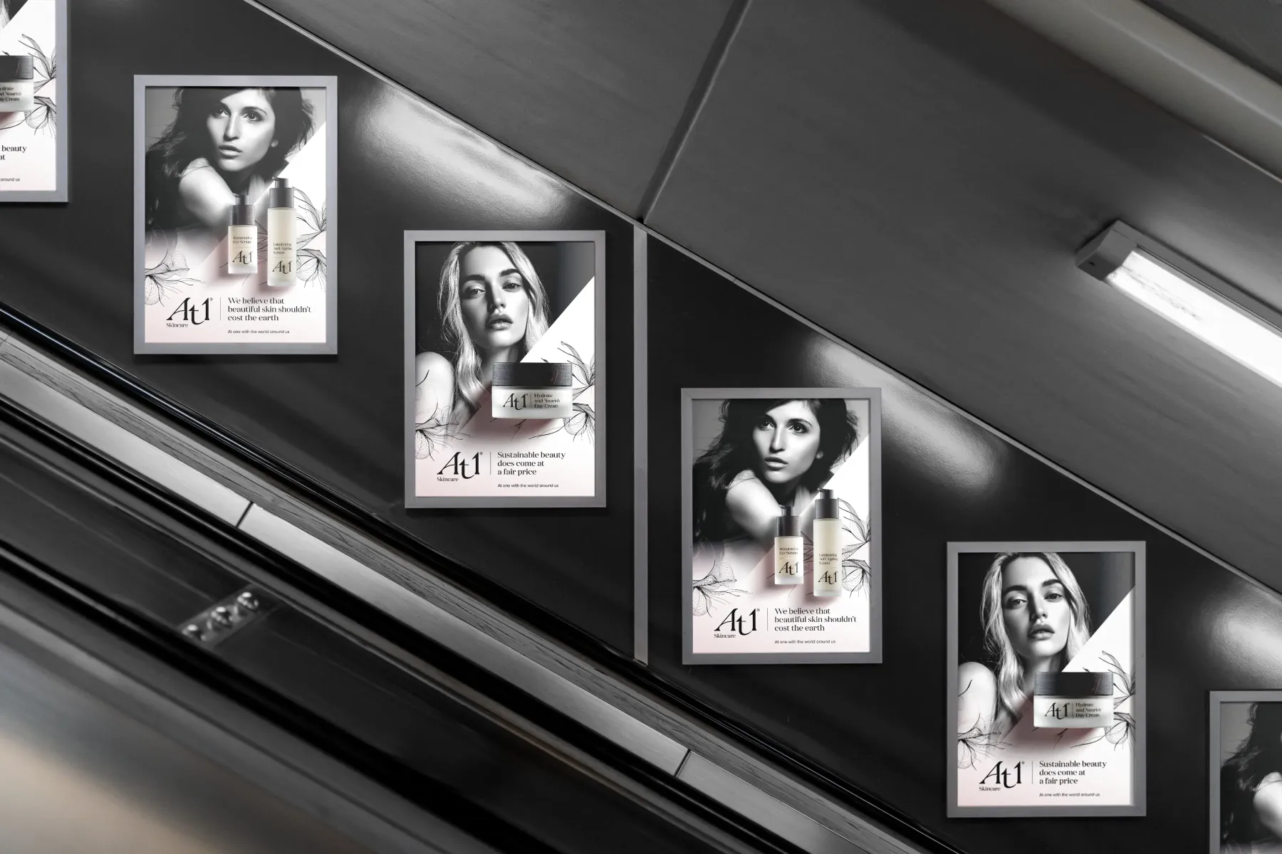 At1 posters in a row, seen from the side of an escalator at an angle from a travellers perspetive